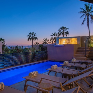 Poolside patio with gorgeous ocean views during sunset