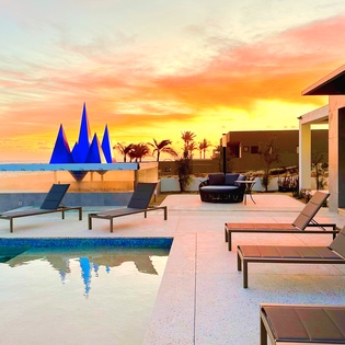 Poolside with beachfront views