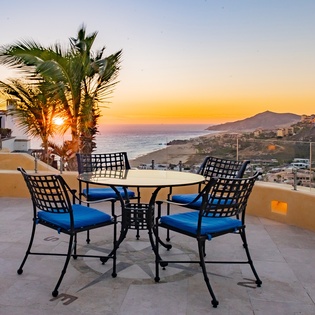 Outdoor seating on patio during sunset