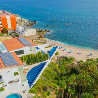 Stunning beachfront property with private pool overlooking pristine sandy beach and crystal-clear Caribbean waters.