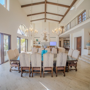 Your grand dining room features soaring ceilings and crystal chandeliers, perfect for memorable meals with loved ones.