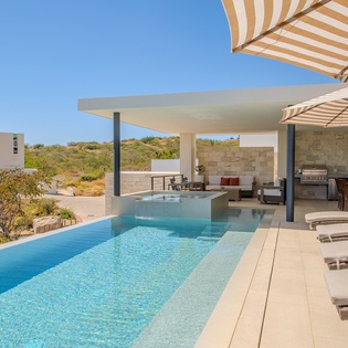 Dive into crystal-clear waters while soaking up sunshine on your private terrace, complete with loungers and outdoor dining.