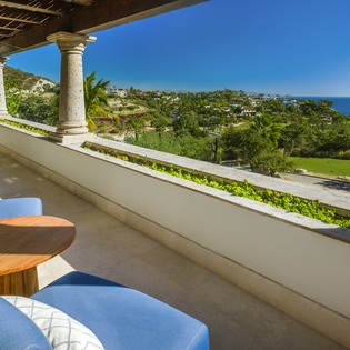 Relax on your private terrace with stunning sea views, tropical gardens, and comfortable seating perfect for morning coffee or sunset cocktails.