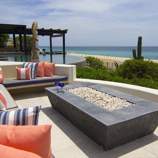 Patio with firepit and beach front view