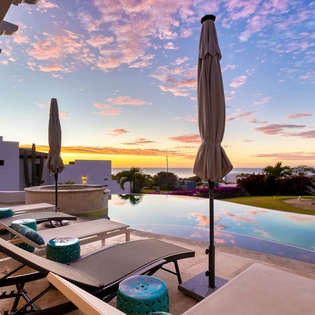 Poolside with beautiful ocean sunset views