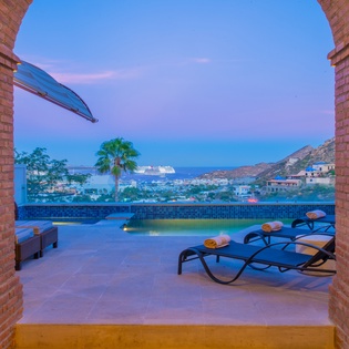 Poolside patio with Cabo view during sunset