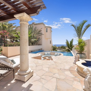 Poolside with firepit and ocean views