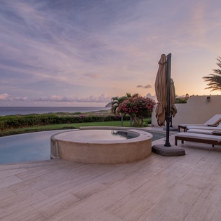 Patio with ocean views during sunset