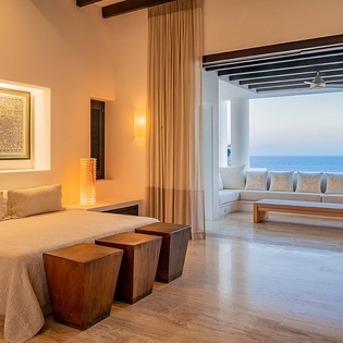 Wake up to endless ocean views stretching beyond your private balcony. Warm wood accents and soothing coastal tones make this your perfect retreat.