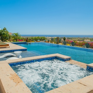 Soak in your private hot tub while gazing at endless ocean views, then cool off in the infinity pool.