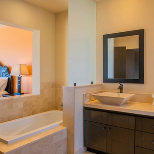 En-suite bathroom with bathtub