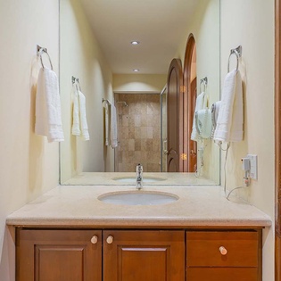 Your private bathroom features plush towels and a refreshing walk-in shower, with thoughtful storage to keep your belongings organized throughout your stay.