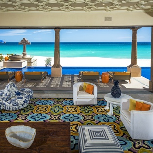 Your living room opens seamlessly to paradise, where turquoise waters meet pristine sand just steps from your terrace.