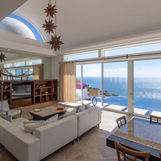Living room with access to outdoor and ocean view