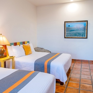 Bedroom suite with 2 queen beds and with incredible ocean views