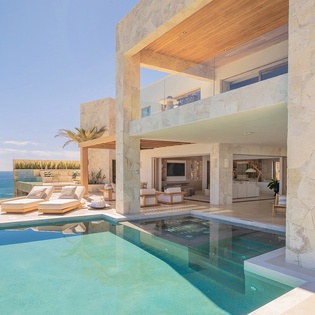 Poolside view of patio with ocean views