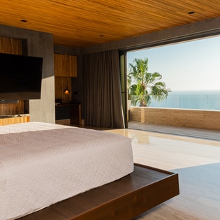 Bedroom suite with terrace access and ocean view