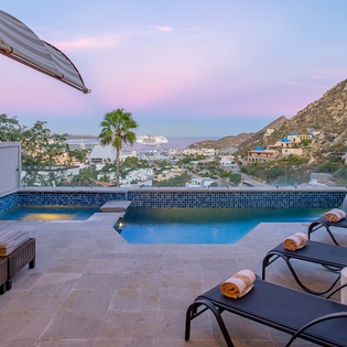 Poolside patio with Cabo view during sunset