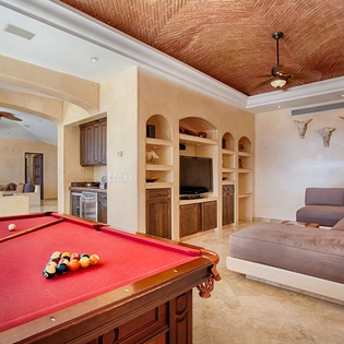 Challenge your group to a game of pool in this open, sun-filled space, then unwind on the plush sectional while enjoying your favorite shows on the built-in entertainment center.