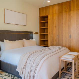 Your spacious bedroom offers comfort with built-in storage for effortless organization during your stay.