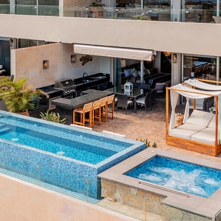 Sunny patio with pool, jacuzzi and lounge
