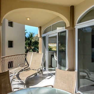 Sunny balcony with outdoor seating