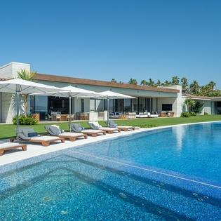 Infinity pool overlooking beachfront views