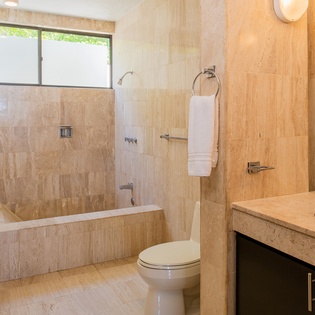 En-suite bathroom with bathtub