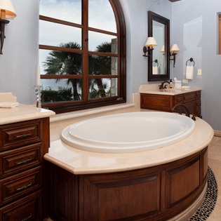 En suite bathroom with bathtub and ocean views