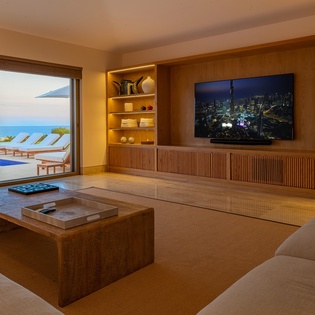 Family area with patio access and ocean views