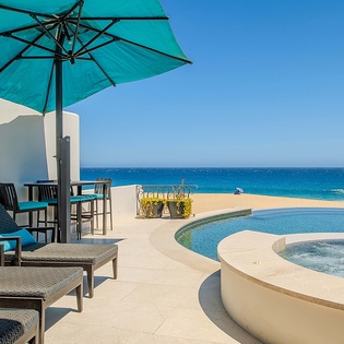 Lounge poolside with stunning ocean views—your private paradise awaits. Soak up the sun, relax on comfortable chairs, and enjoy the sparkling turquoise water just beyond your retreat.