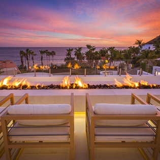 Firepit seating with ocean view during sunset