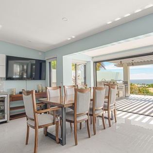 Savor meals in your elegant dining space with stunning ocean views and seamless indoor-outdoor flow to the terrace.
