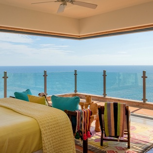 Bedroom suite with private terrace and ocean views