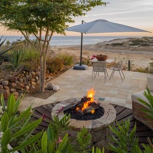 Patio with firepit and ocean view