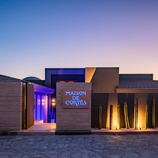 Front exterior of villa during sunset