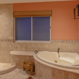 En-suite bathroom with bathtub and shower