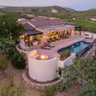 Bird's eye view of villa during sunset