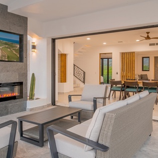 Outdoor living area with fireplace and TV