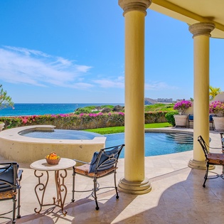 Poolside patio with ocean views and jacuzzi