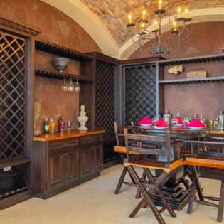 Your private wine cellar awaits with elegant storage, intimate dining, and warm lighting for perfect tastings.