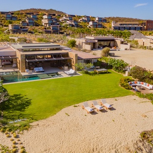Villa exterior and beachfront setting