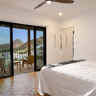 Wake to stunning mountain views from your cozy bedroom, where morning coffee on your private balcony becomes a daily ritual.