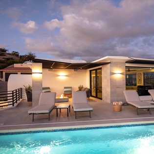 Poolside view of villa exterior