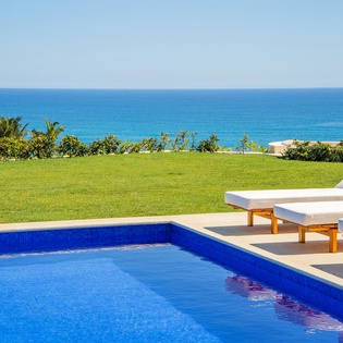 Sunny poolside with incredible ocean views