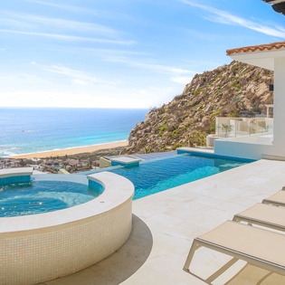 Lounge chairs, jacuzzi and infinity pool