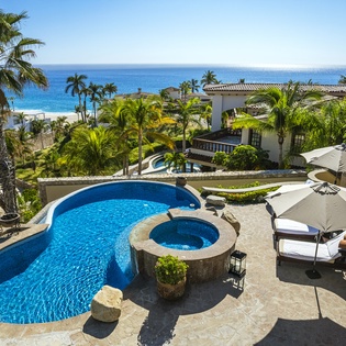 Patio with pool and jacuzzi with beach views