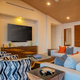 Sink into this stylish living room with modern comforts—perfect for movie nights or quiet moments with your favorite book.