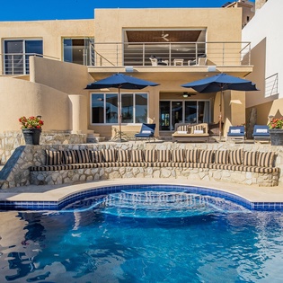 Lounging poolside with exterior view
