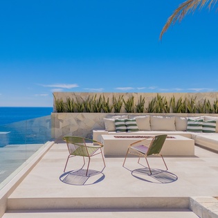 Sunny patio with outdoor seating, ocean views and firepits